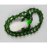 A Chinese white jade snow drop pendant with Heitian green jade bead necklace.