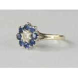 An 18ct white gold, sapphire and diamond ring, of flowerhead form, size N, 4.5g.