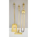 A 19th century brass fireside set.