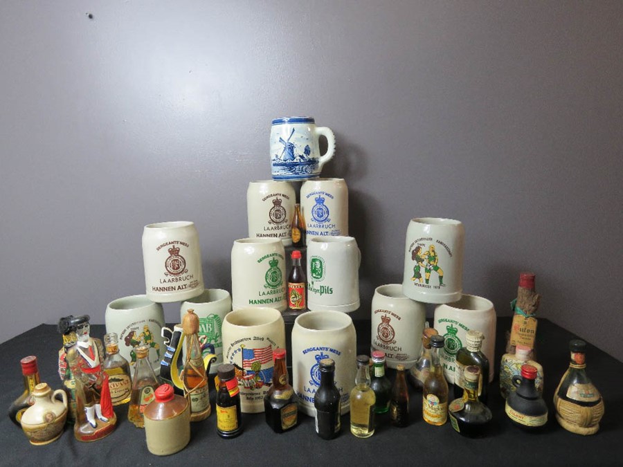 A large group of stone tankards, German, together with various groups of alcohol miniatures.