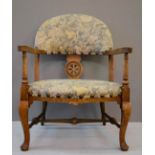 A child's bow armchair with wheel back and upholstered seat.