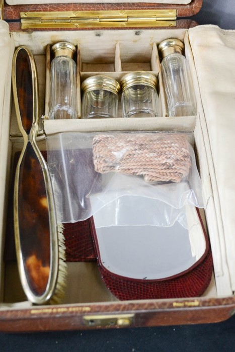 A leather travelling vanity case, by Bruford & Son, Exeter, the compartments containing silver - Image 2 of 5