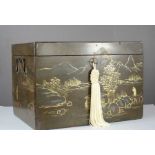 A Chinoiserie lacquered box with key, depicting figural scenes, with gilded highlights.