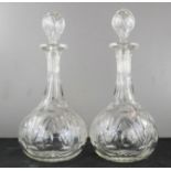 A pair of cut glass decanters, 31cm high.
