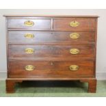 A 19th century mahogany chest of drawers, two over three long graduate drawers raised on bracket