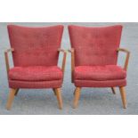 A pair of 1950s chairs in original red upholstery.