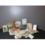 A group of antique photographs, birthday cards and other items.