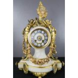 A French 19th century alabaster and gilt metal mantle clock, 41m high.
