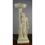 A 19th century marble lamp in the form of a woman.