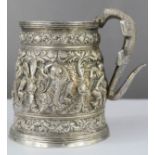 A 19th century white metal Asian cup with Iguana shaped handle.