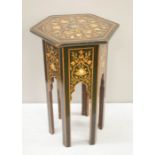 An Indian octagonal top table, ebonised and inlaid with mother of pearl and marquetry.