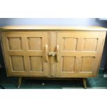 A retro side board with panelled doors.