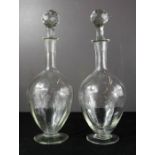 A pair of English crystal decanters.