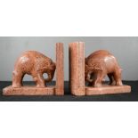 A pair of red marble book ends in the form of elephants, 11cm high.