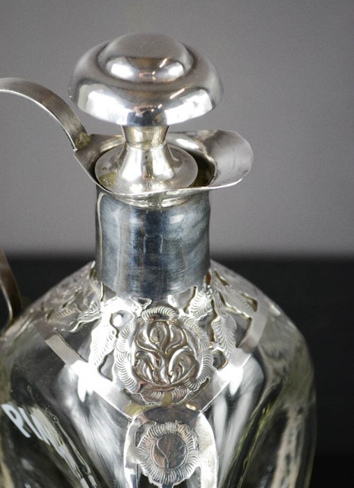 A Pinch decanter with silver mounts and cork top, pierced and engraved with decoration, 24cm high. - Image 2 of 2