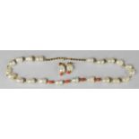A 9ct gold, natural pearl and coral necklace and earrings set, 46.2g total weight.