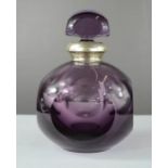 A French 800 grade silver collared amethyst coloured bottle and stopper, 16cm high.
