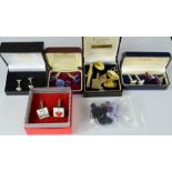 Five pairs of cufflinks, a group of cord cufflinks, and a quantity of badges and tie clip.