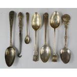 A group of silver spoons, including a Scottish tea spoon with thistle top, a Fantail Club spoon, and