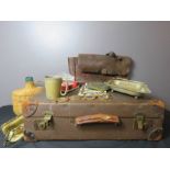 A vintage suitcase containing a satchel, silver plateware, pit game, walets etc.