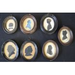 A group of oval framed Victorian silhouettes.