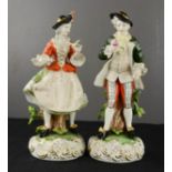 A pair of Kunst Dresden Art Bavaria figures, 24cm high.