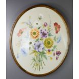An oval embroidered panel depicting flowers.