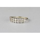 A 14ct gold and diamond ring, fourteen diamonds set in two rows, size P/Q, 3.7g.