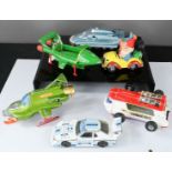 A collection of model cars including Noddy's car with three figures, three Thunderbird models and