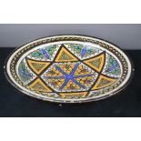 A rare tribal glazed pottery Iznik dish.