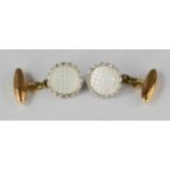 A pair of 9ct gold and mother of pearl cufflinks.