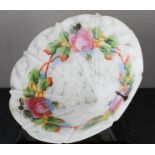 A 1940s glass ceiling shade, opaque with floral pattern.