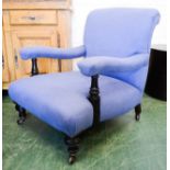 An armchair upholstered in blue.