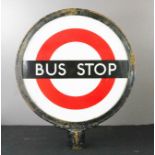 An original London 1960s cast iron and enamelled Bus Stop sign.