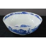 An early 19th century Chinese blue and white bowl, depicting home of an Emperor with figures on