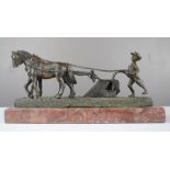 A spelter group ; boy ploughing the field with horses, 11cm high, 23cm long.