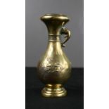 A Japanese brass vase, signed to the base.