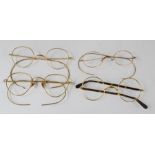 A group of four pairs of spectacles, Victorian and Edwardian examples, gold plated frames.