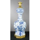 An 18th century blue and white Delft vase converted into a lamp base.