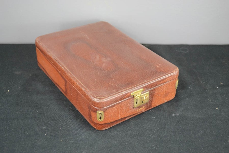 A leather travelling vanity case, by Bruford & Son, Exeter, the compartments containing silver - Image 5 of 5