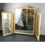 A gold painted triptych mirror.