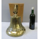 A large brass pub bell.