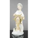 Nao Lladro porcelain figure of a sailor boy and his dog, 23cm high.