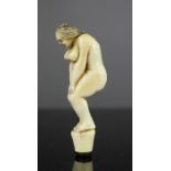 A prisoner of war style bone carved erotic pipe tamper.