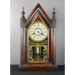 A 19th century mahogany mantle clock with gilded face, Roman Numeral dial.