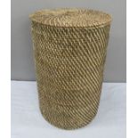 A wicker linen basket.