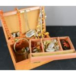 A leather jewellery box containing costume jewellery, faceted amber beads and earrings, two wine