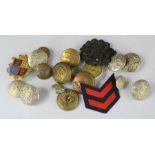 A group of military dress buttons, including an RAF badge.
