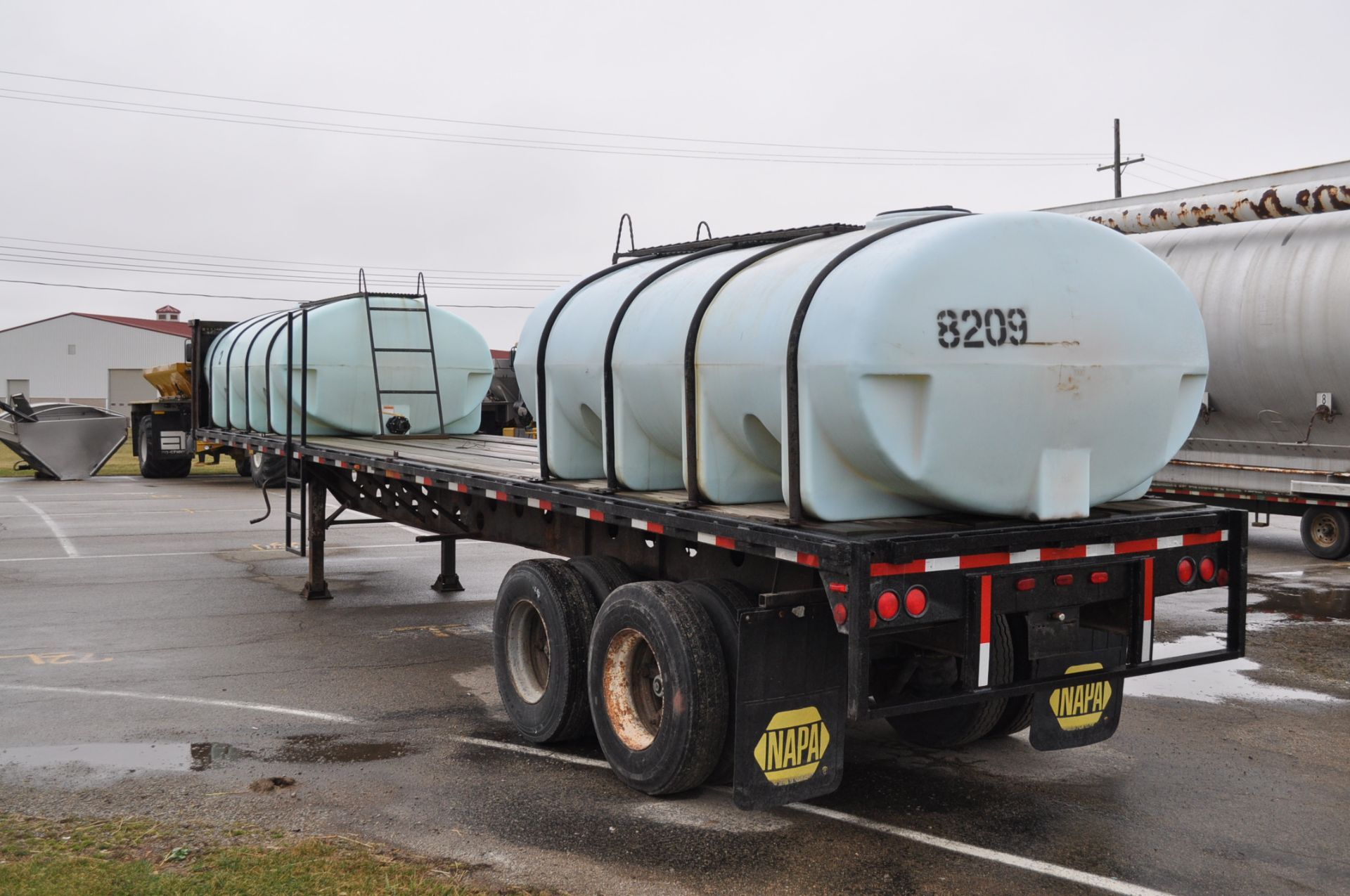 1982 Transcraft 40’ flat trailer with 2-2000gl poly tanks - Image 2 of 7