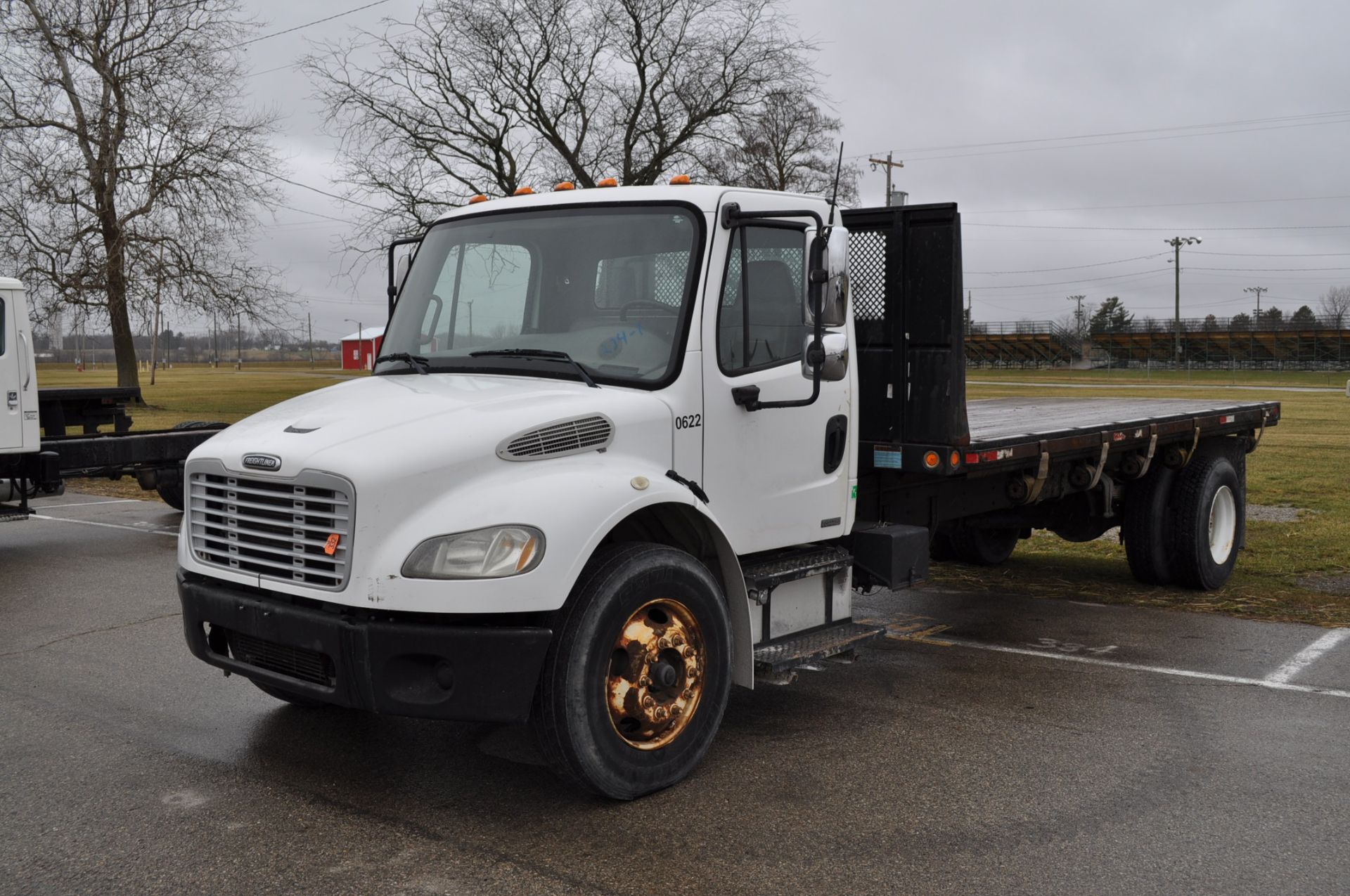 2006 Freightliner Business class M2, CAT C7 engine, auto trans, single axle, 18.5’ flat bed